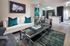 Elegant living area with stylish decor, featuring a modern kitchen, luxurious seating, and contemporary artwork for sophisticated urban living.