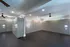 Spacious secure mailroom with sleek modern parcel lockers and ambient lighting, perfect for convenient package management.