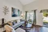 Inviting living room with elegant decor, cozy seating, and abundant natural light, perfect for relaxation.
