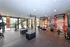 Modern fitness center featuring state-of-the-art gym equipment, bright natural light, and sleek design.