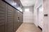 Sleek package room featuring modern parcel lockers with stylish lighting and elegant flooring.