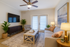 A spacious and well-lit living room designed for comfort and relaxation.