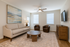 A spacious and well-lit living room designed for comfort and relaxation.