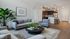 A spacious and well-lit living room designed for comfort and relaxation.