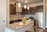 Modern kitchen with stainless steel appliances, sleek granite countertops, and stylish cabinetry, offering a chic and functional cooking space.