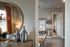 Charming apartment interior showcasing elegant decor with a stylish mirror, artistic vases, and a sleek open shelving unit.