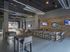 Contemporary indoor lounge with stylish bar seating, modern industrial decor, and ample natural light.