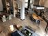 Luxurious open-concept living space with modern kitchen, stylish lounge area, and high ceilings, perfect for sophisticated apartment living.
