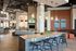 Luxurious apartment lounge with modern decor, featuring a stylish bar area, comfortable seating, and elegant lighting.