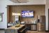Modern kitchen with sleek stainless steel appliances, elegant pendant lights, and a stylish backsplash. Features a large granite island perfect for entertaining.