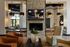 Sophisticated living area with modern fireplace, elegant furnishings, and stylish pendant lights creating a warm ambiance.