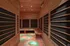 Luxurious sauna room with warm wooden interiors and modern lighting, perfect for relaxation and comfort.