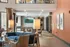 Elegant and cozy living area with modern decor, featuring a plush blue sofa, ambient lighting, and a sleek entertainment setup.