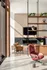 Luxurious apartment living room featuring contemporary design with plush seating, stylish shelving, and a modern fireplace with elegant stone accents.