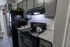 Modern kitchen with sleek black appliances, granite countertops, and stylish cabinetry, perfect for culinary enthusiasts.