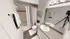 Bright and modern bathroom featuring a polished granite countertop, elegant shower curtain, and stylish decor.
