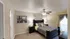 Cozy and elegant bedroom featuring a stylish bed with plush pillows, warm lighting, and tasteful wall decor, perfect for relaxation.