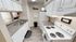 Charming kitchen with sleek countertops, white cabinetry, and modern appliances, offering a cozy and inviting space.