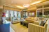 Inviting living room with elegant decor, soft lighting, and comfortable seating, ideal for relaxation and gatherings.