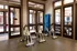 Modern fitness center featuring sleek indoor cycling bikes with a stylish glass-walled design.