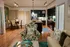 Inviting apartment with chic open-concept living and dining area, featuring modern kitchen and stylish decor.