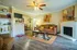 Inviting living room with elegant decor, cozy sofa, stylish coffee table, and modern fireplace, perfect for relaxation and entertainment.
