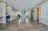 Bright and inviting apartment interior with elegant hardwood flooring, modern seating area, and chic decor, creating a warm and stylish living space.