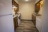 Cozy kitchen with modern appliances, sleek cabinetry, and elegant wood flooring, perfect for culinary creativity.