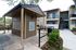 Cozy apartment complex featuring a convenient mail center and lush greenery, enhancing the community atmosphere.