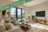 Inviting living room with modern decor, comfortable seating, and abundant natural light highlighting stylish furniture.