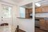 Charming kitchen with natural light, featuring modern appliances, granite countertops, and a cozy breakfast bar.