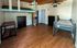 Versatile room with stylish loft bed, ample storage, and modern wood flooring, offering a blend of functionality and comfort.