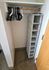 Efficient closet space featuring organized shelving and ample room with hangers for a streamlined storage solution.