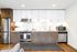 Sleek modern kitchen with stainless steel appliances, white cabinets, and hardwood flooring, perfect for culinary enthusiasts.