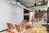 Chic and modern lounge at Midtown Square featuring stylish seating, vibrant wall art, and contemporary lighting.