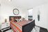 Chic bedroom with colorful bedding, modern decor, large window offering stunning scenic views, and cozy ambiance.
