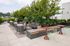 Chic rooftop terrace featuring modern seating, lush greenery, and expansive city views, perfect for relaxation and entertaining.