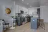 Contemporary kitchen with sleek cabinets, stainless steel appliances, and a stylish breakfast bar in a modern apartment.