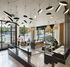 Chic modern lobby with stylish lighting, comfortable seating areas, and large windows offering abundant natural light and outdoor views.
