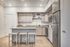 Modern kitchen with sleek granite countertops, elegant cabinetry, and stainless steel appliances, offering a stylish and functional space for cooking and entertaining.