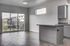 Bright and airy apartment with modern open-concept kitchen and large sliding doors leading to a private balcony with scenic views.