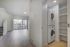 Modern apartment with spacious living area, large windows for ample natural light, and convenient in-unit laundry.