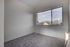 Bright and airy room with large window offering stunning mountain views, perfect for a serene living space.