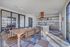 Modern and inviting apartment dining area with open-concept kitchen.