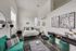 Chic bedroom with stylish decor, featuring large windows, modern furniture, and vibrant accents for a cozy retreat.