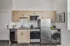 Modern kitchen with sleek stainless steel appliances, stylish wood cabinetry, and subway tile backsplash.