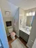Chic bathroom with stylish vanity, warm lighting, and cozy decor for a modern apartment living experience.