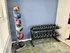 Modern home gym corner with vibrant medicine balls and sleek dumbbell rack, perfect for fitness enthusiasts.