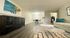 Chic apartment interior with elegant wood flooring, modern dining area, and cozy living space featuring stylish decor.