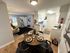 Inviting open-concept apartment featuring a chic dining area, cozy living space, and modern kitchen.